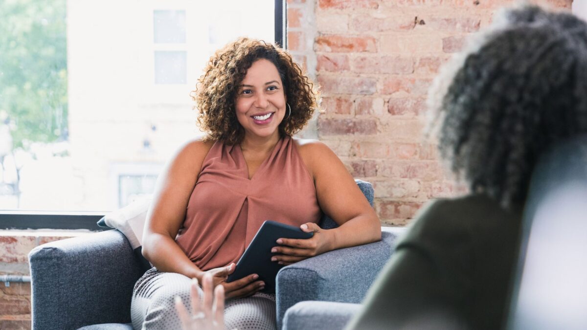 a therapist speaking with a patient