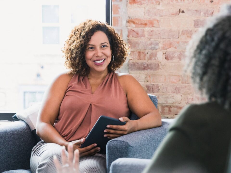 a therapist speaking with a patient