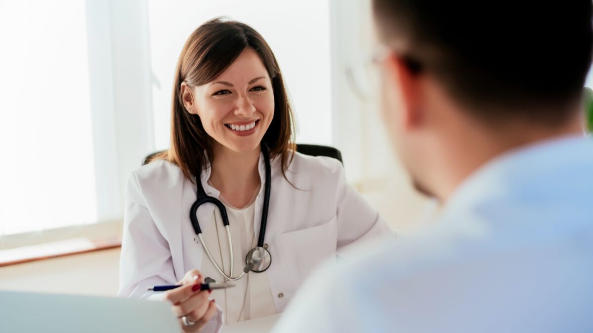 A doctor speaking to a patient