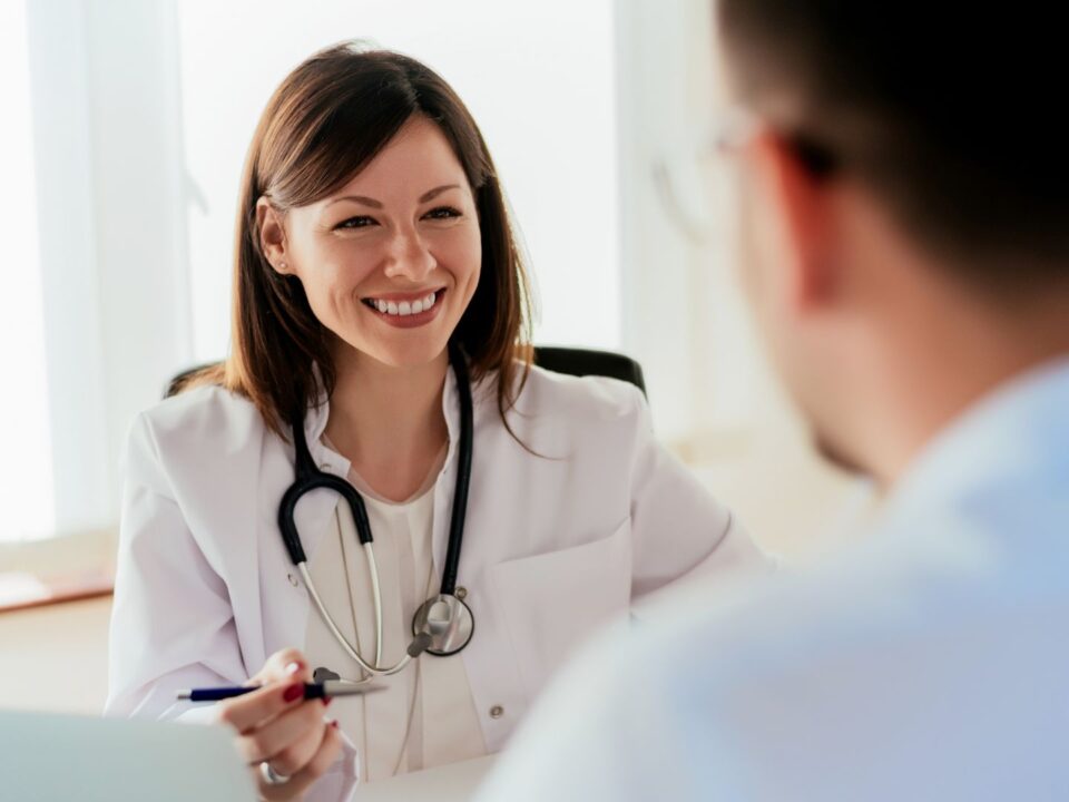 A doctor speaking to a patient