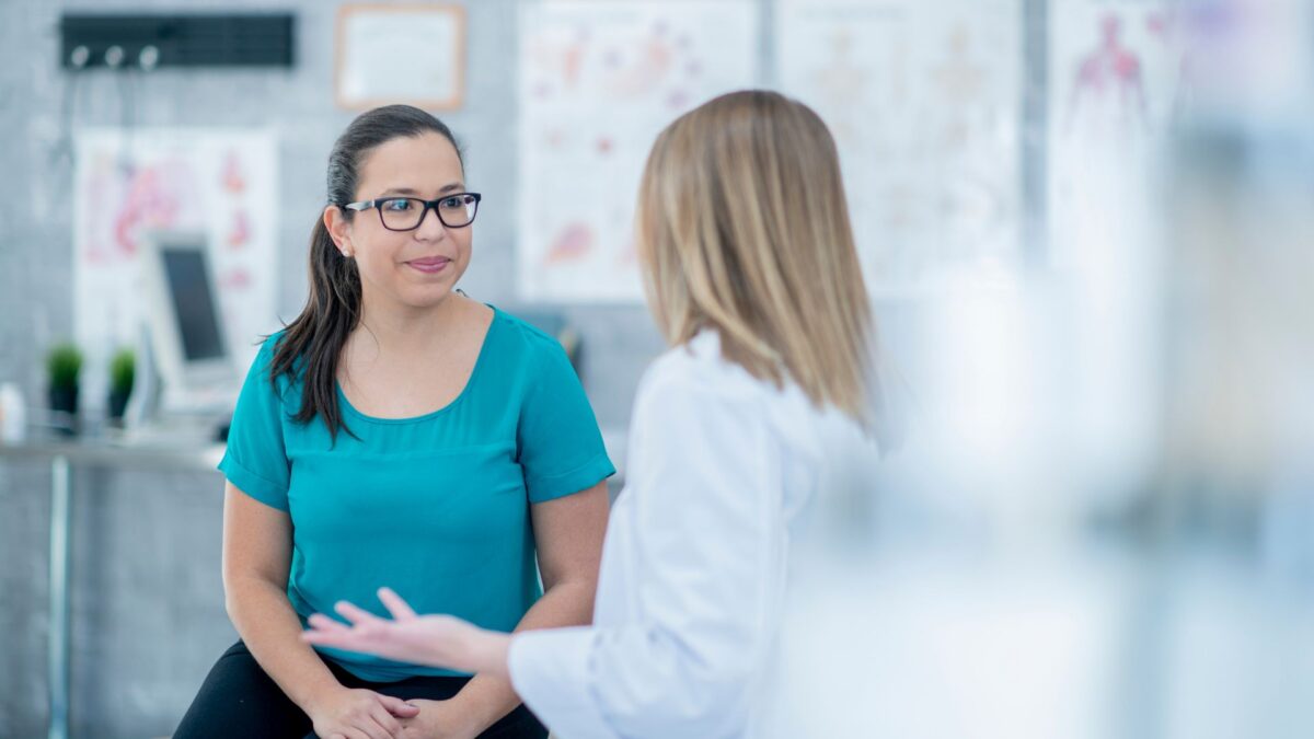 A patient speaking with a doctor